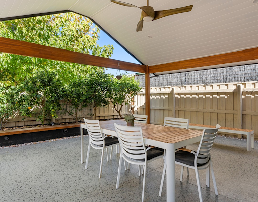 A table and chairs in a home extension.